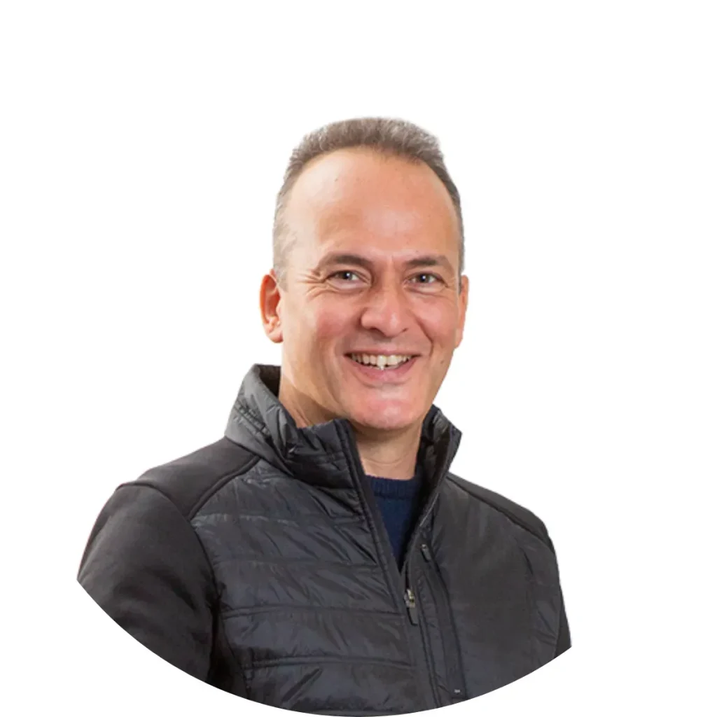 Smiling man in a black jacket, representing customer engagement and feedback strategies for enhancing online reputation.